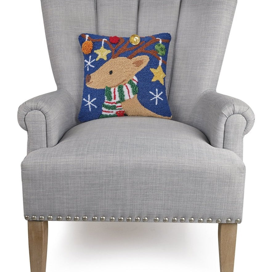 3D Reindeer with Bell Hooked Christmas Throw Pillow on an armchair, showing the throw pillow at room scale, 14x14 inch