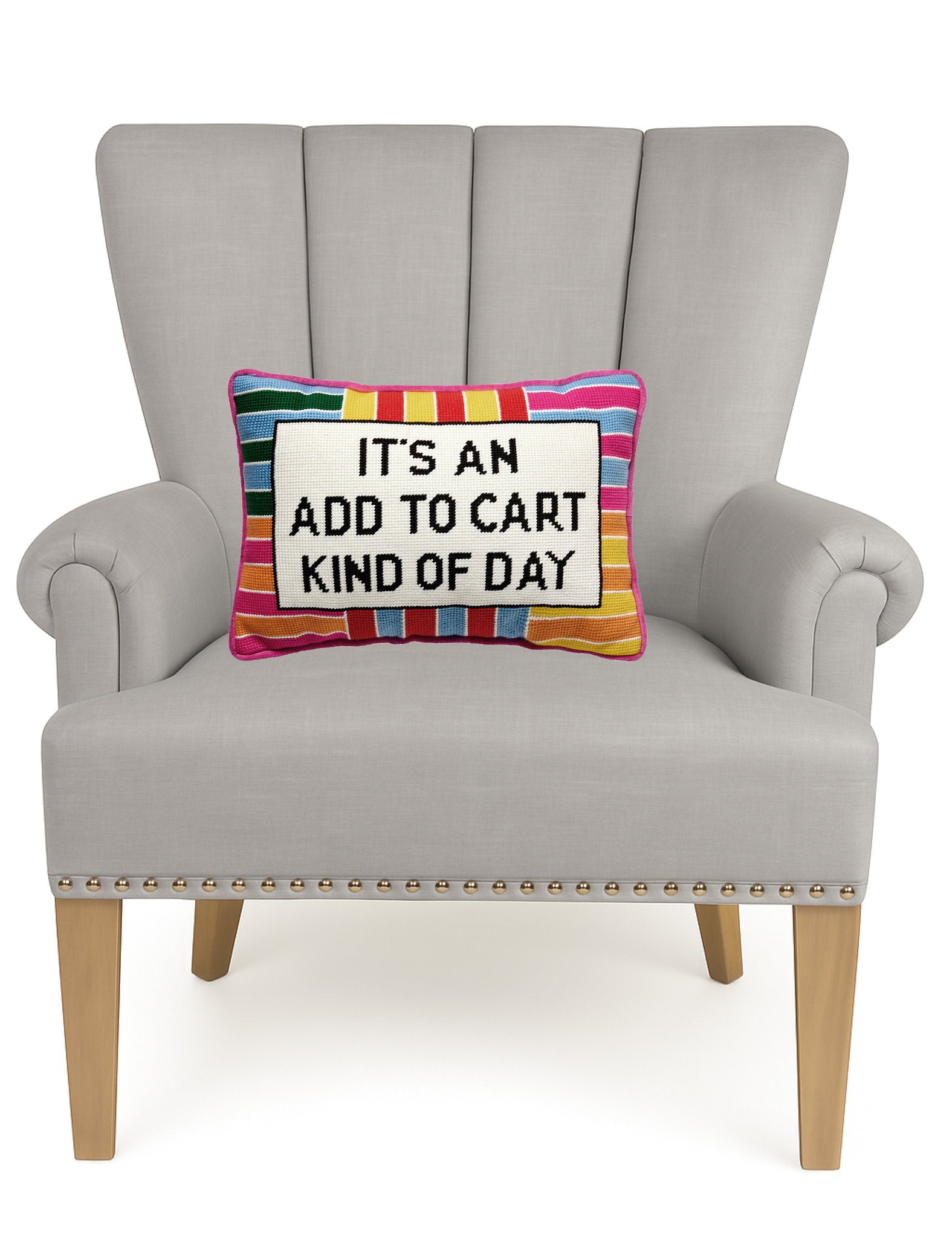 Add to Cart Embroidered Needlepoint Throw Pillow on an armchair, showing the throw pillow at room scale, 10x14 inch