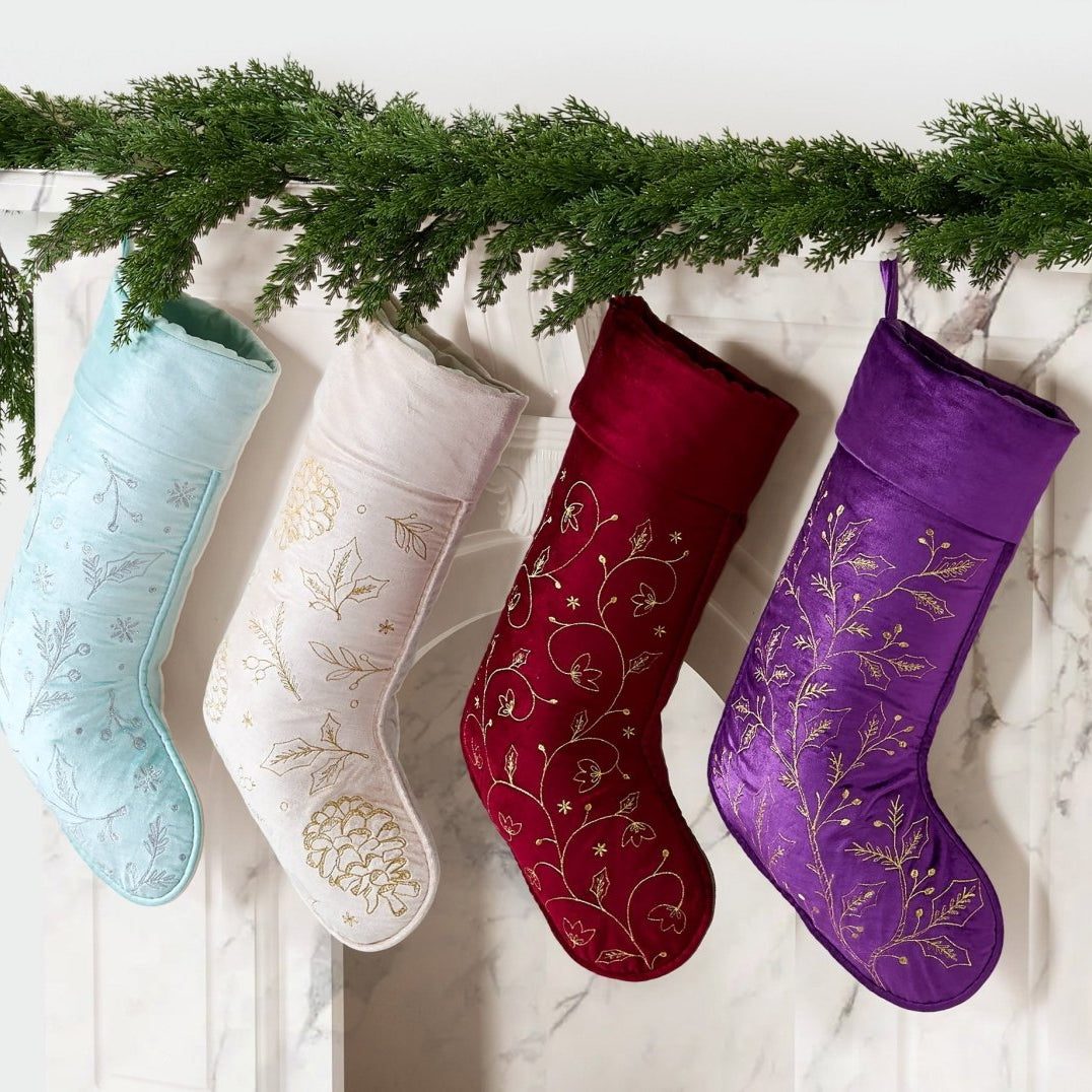 All Over Foliage Embroidered Christmas Stocking shown alongside other designs in the same collection, 12x20 inch
