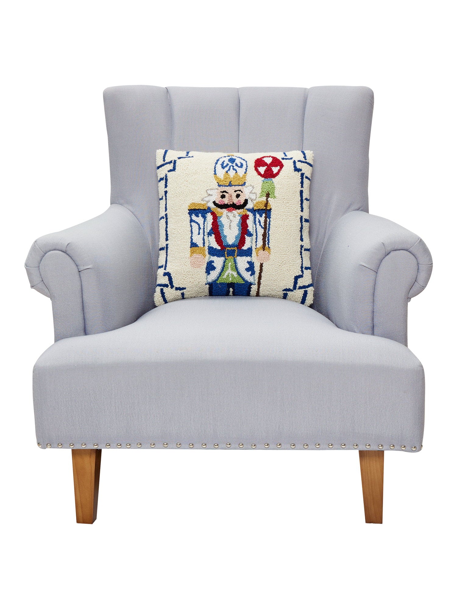 Bamboo Chinoiserie Nutcracker Hooked Wool Christmas Throw Pillow on an armchair, showing the throw pillow at room scale, 16x16 inch