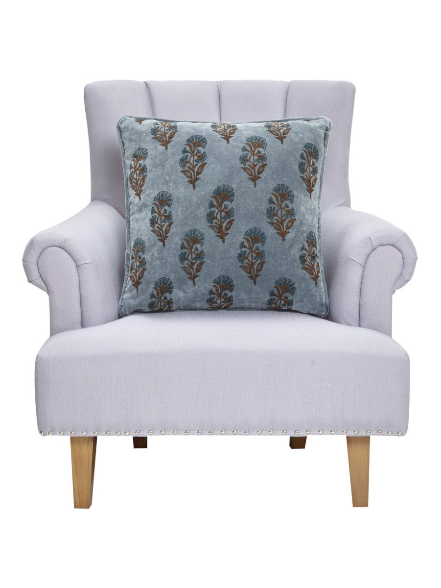 Block Print Velvet Mughal Flower Throw Pillow on an armchair, showing the throw pillow at room scale, 20x20 inch