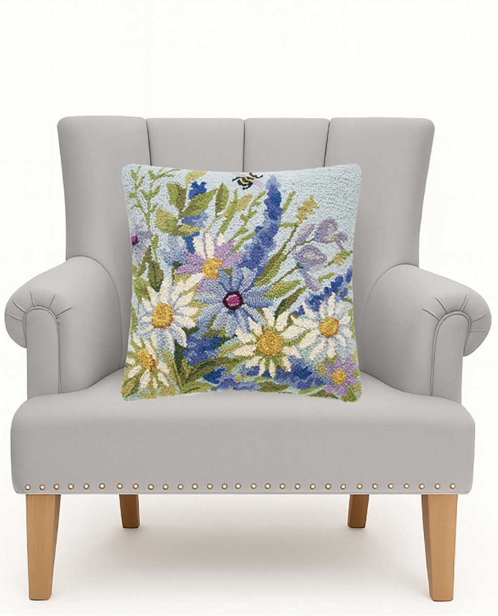 Blue Wildflowers Hooked Wool Throw Pillow on an armchair, showing the throw pillow at room scale, 18x18 inch