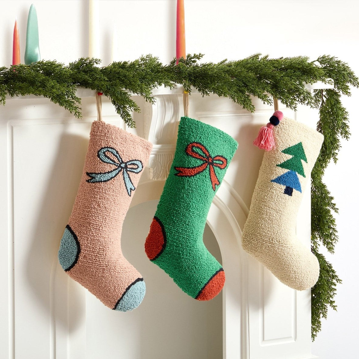 Bow Green & Red Hooked Wool Christmas Stocking shown alongside other designs in the same collection, 12x20 inch