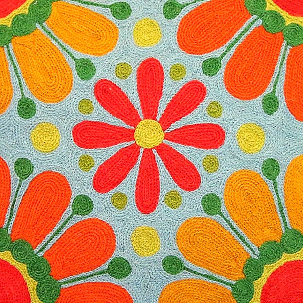 Bright 60s Boho Peace Love Embroidered pillow fabric closeup showing hand-embroidered needlepoint wool texture and color detail