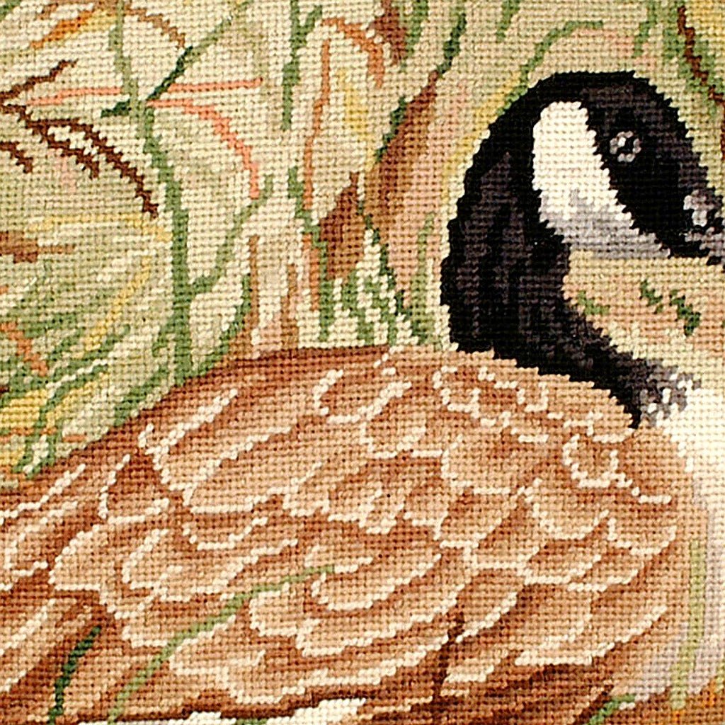 Hand-stitched wool detail of Canada Goose Rustic Wildlife needlepoint pillow showing intricate weave pattern and texture
