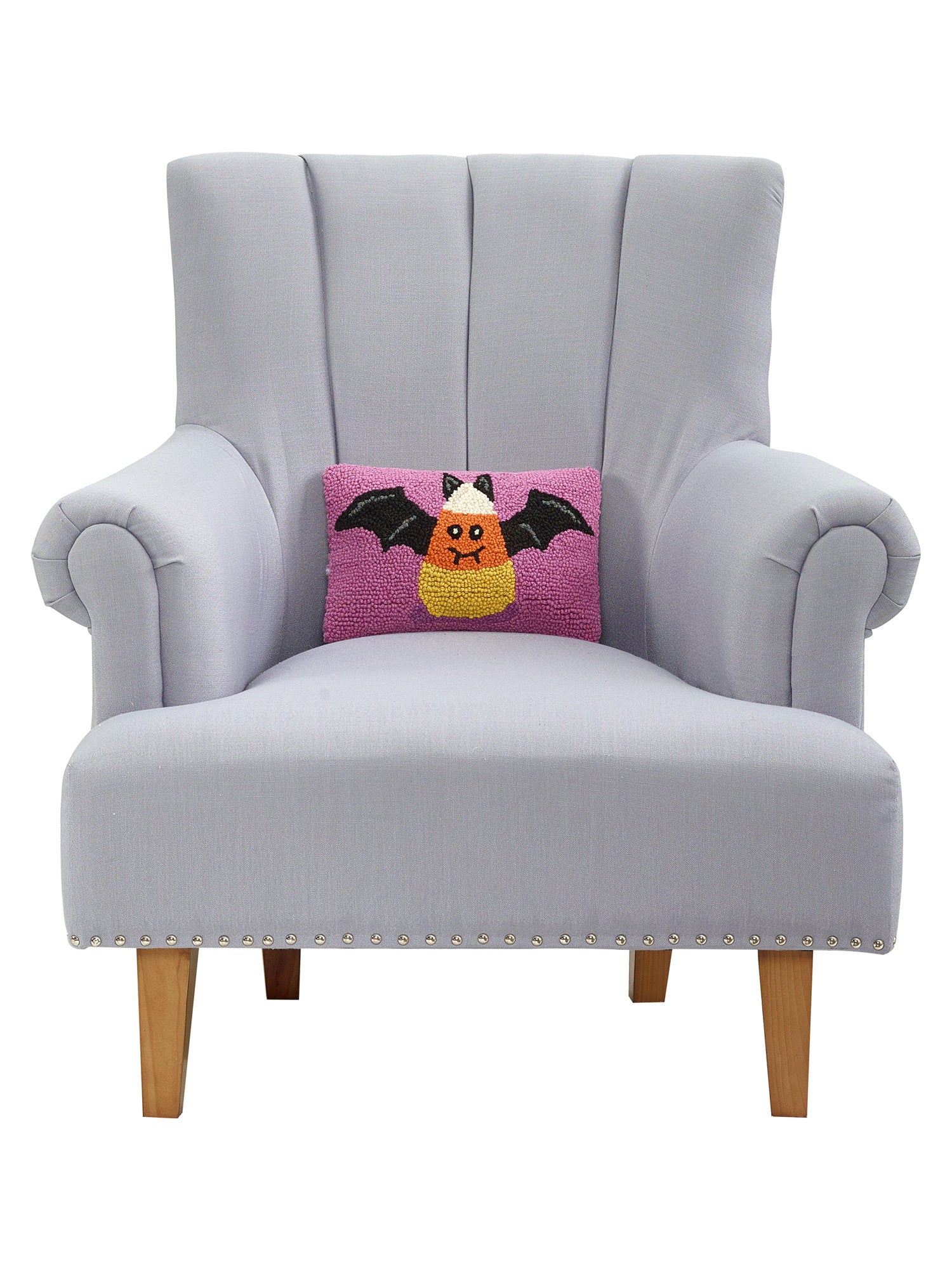 Candy Bat Hooked Wool Halloween Throw Pillow on an armchair, showing the throw pillow at room scale, 8x12 inch