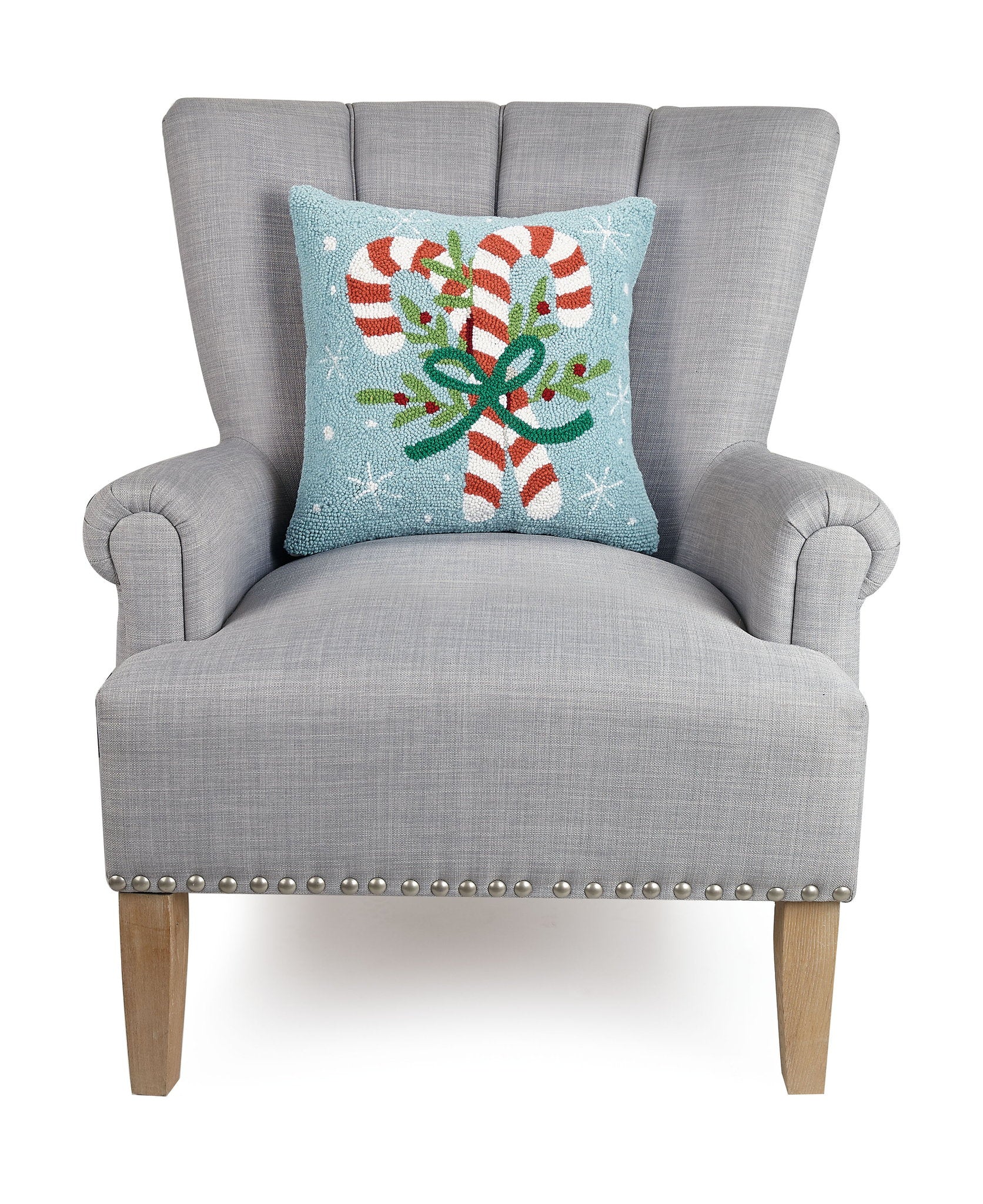 Candy Canes Hooked Wool Christmas Throw Pillow on an armchair, showing the throw pillow at room scale, 16x16 inch