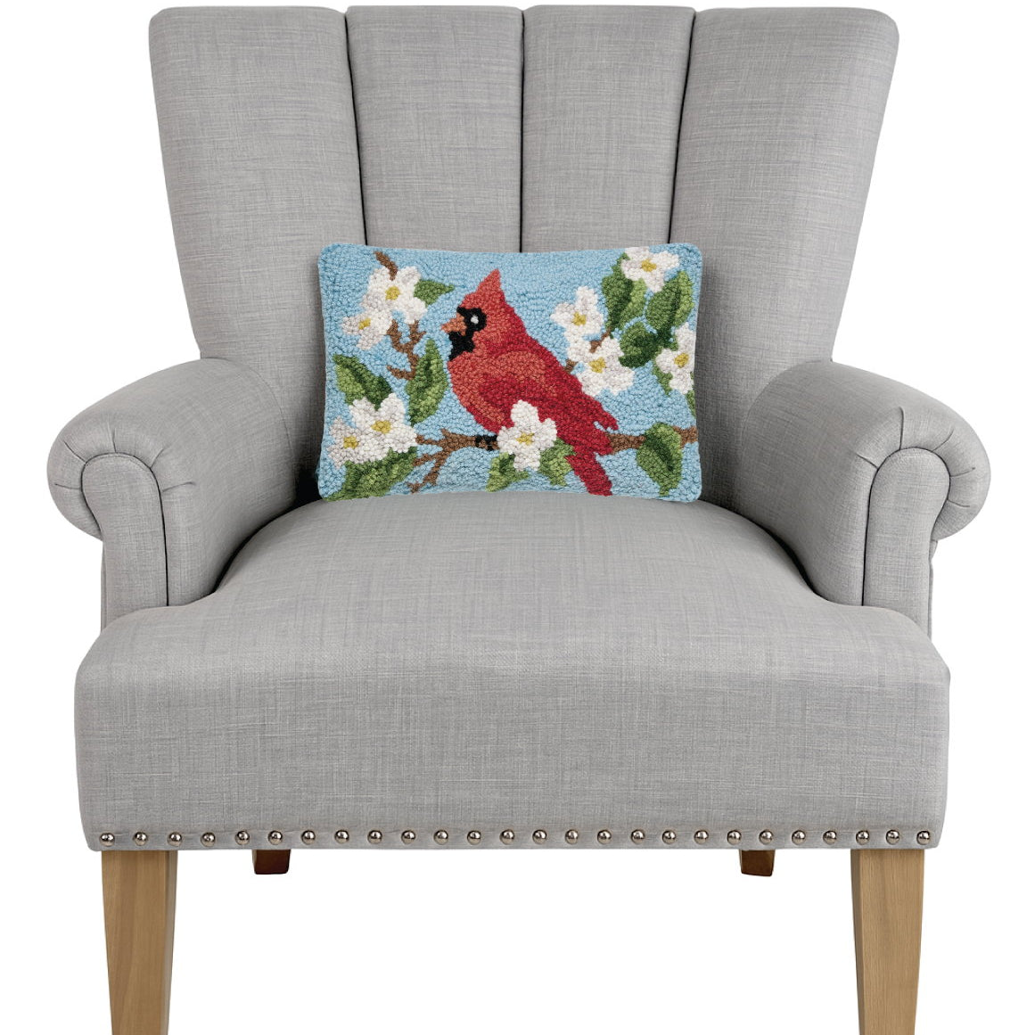 Cardinal Hooked Wool Throw Pillow on an armchair, showing the throw pillow at room scale, 8x12 inch