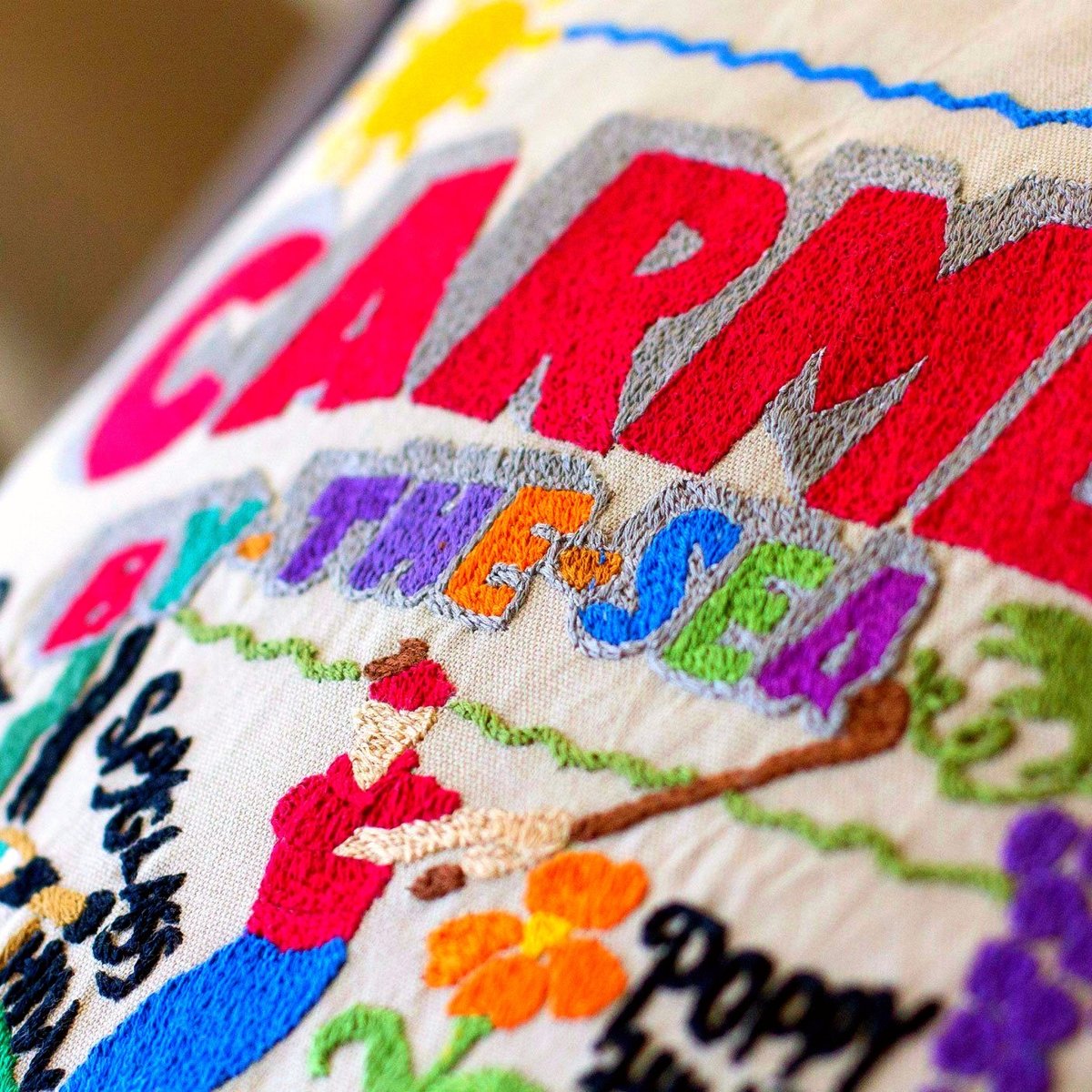 Carmel, CA Coastal City Embroidered Travel Pillow - close-up detail of hand-embroidered needlepoint stitching