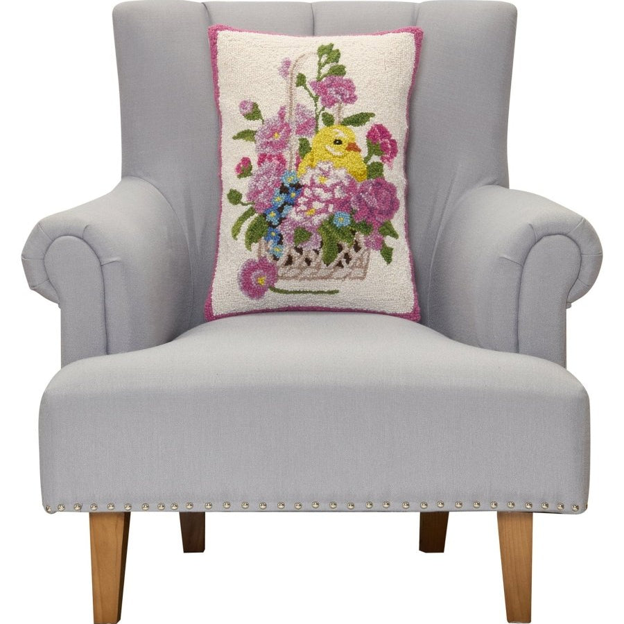 Chick Hooked Wool Easter Throw Pillow, 14x20 inch, standing upright on a gray armchair seat