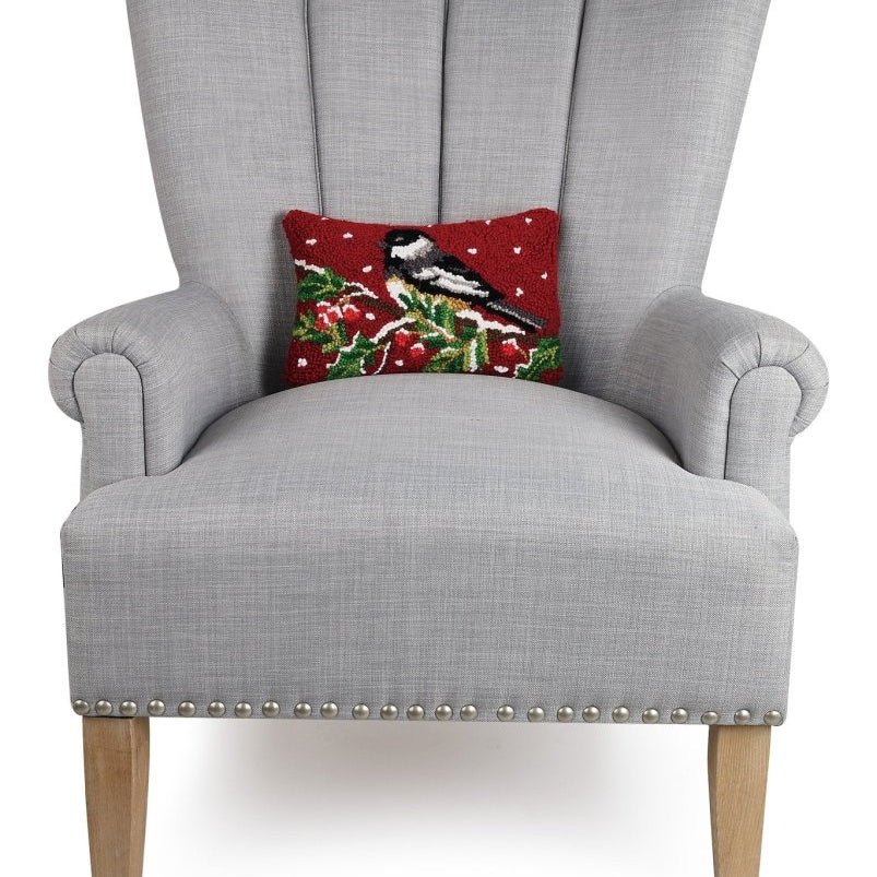 Chickadee on Branch Hooked Wool Christmas Throw Pillow on an armchair, showing the throw pillow at room scale, 8x12 inch