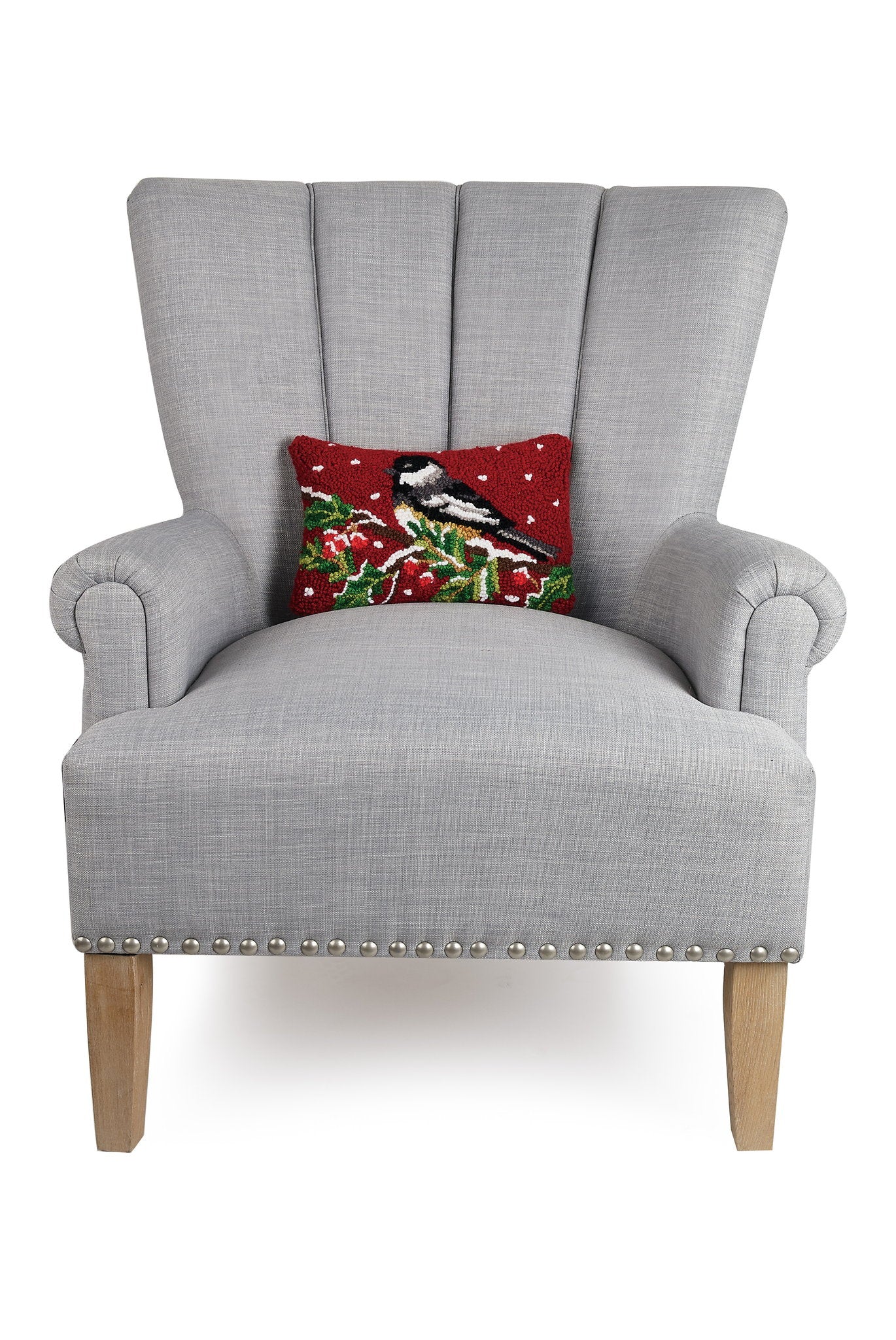 Chickadee on Branch Hooked Wool Christmas Throw Pillow on an armchair, showing the throw pillow at room scale, 8x12 inch