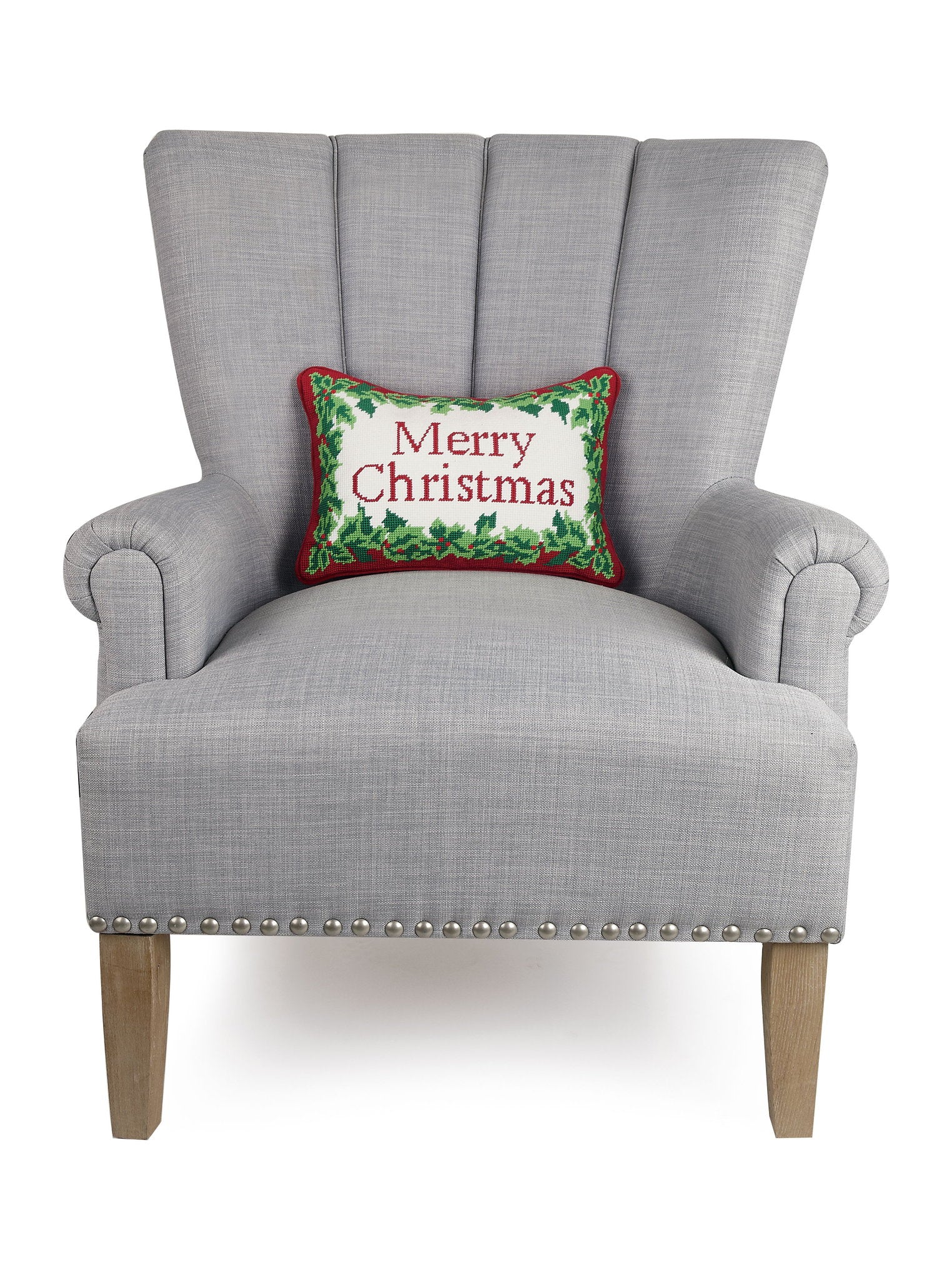 Christmas Embroidered Needlepoint Throw Pillow on an armchair, showing the throw pillow at room scale, 9x16 inch