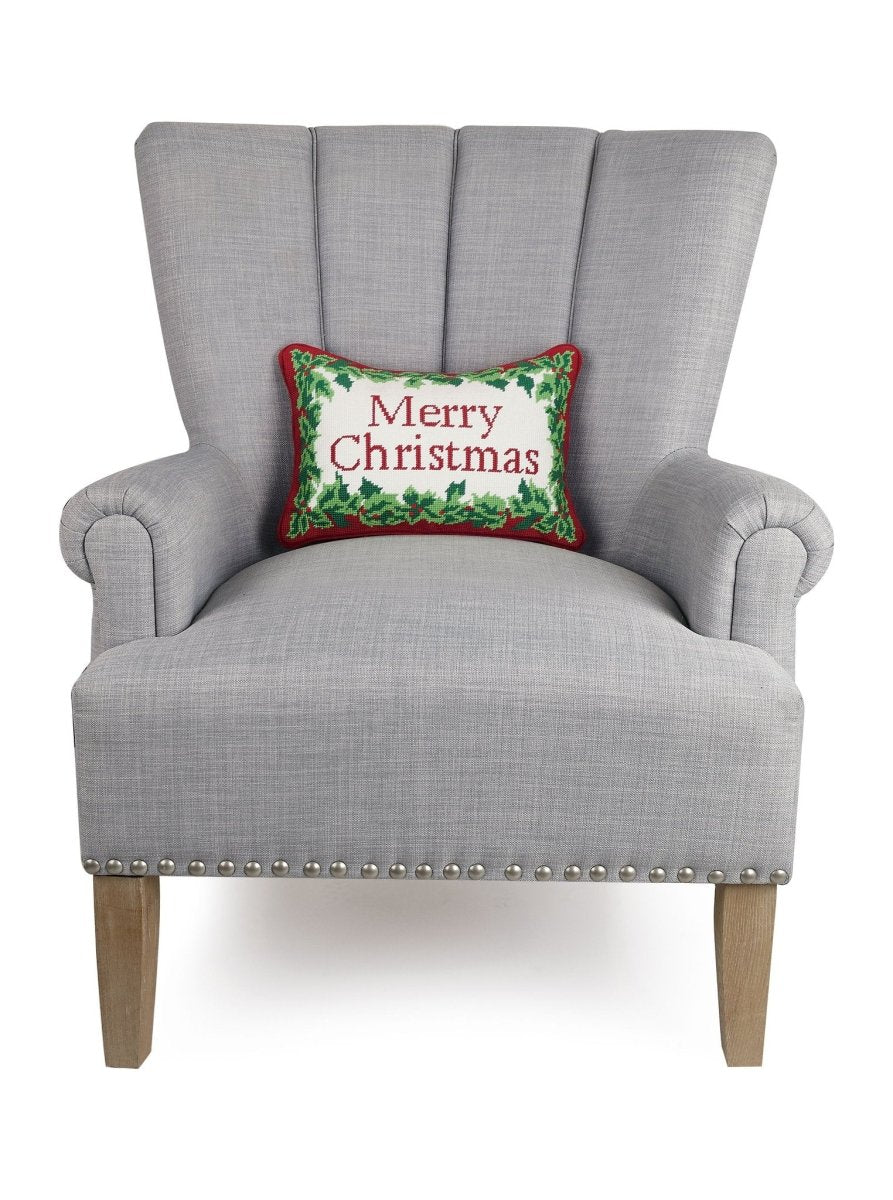 Christmas Embroidered Needlepoint Throw Pillow on an armchair, showing the throw pillow at room scale, 9x16 inch