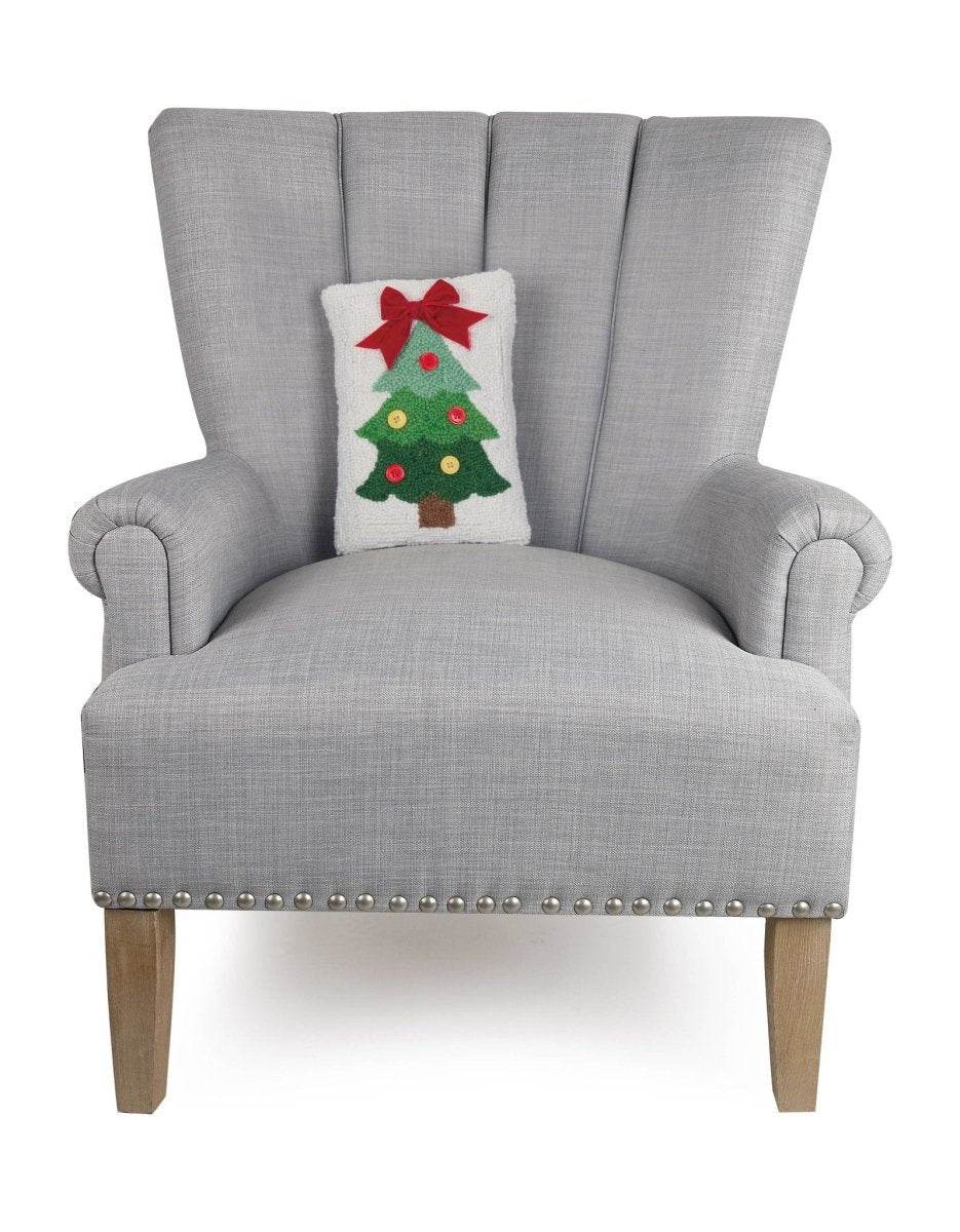 Christmas Tree Ribbon Hooked Wool Throw Pillow on an armchair, showing the throw pillow at room scale, 8x12 inch