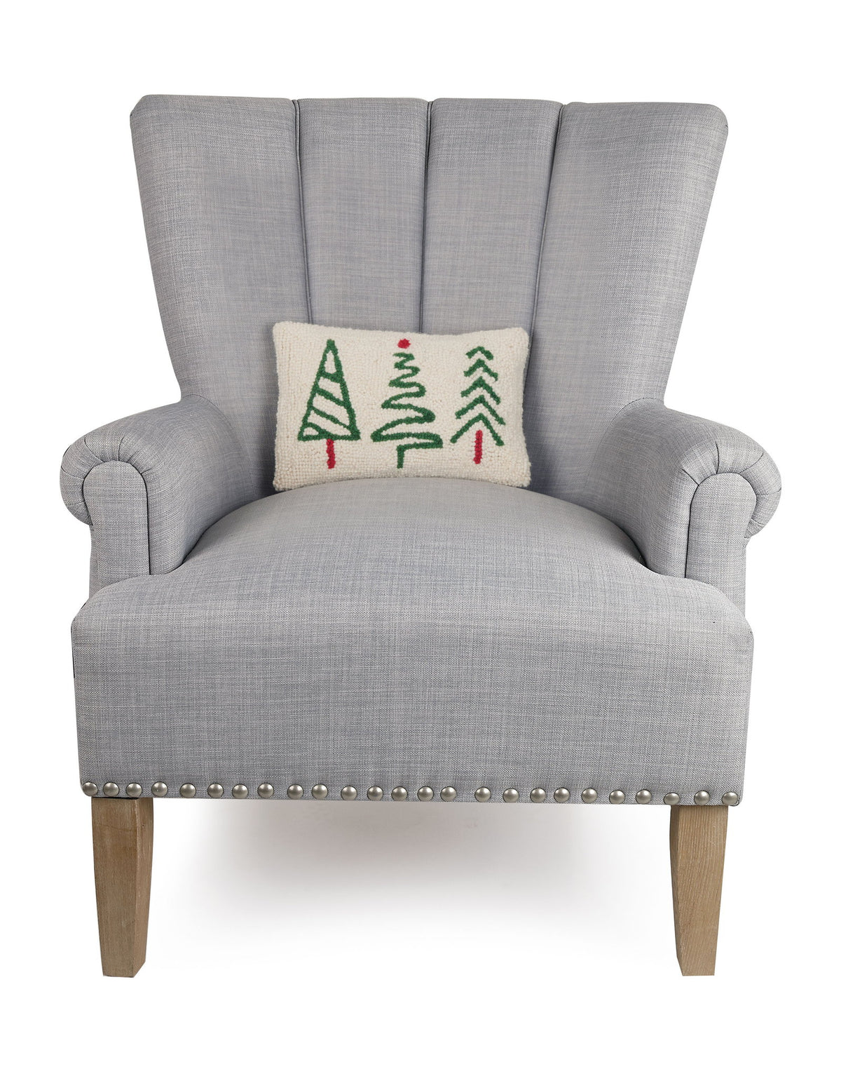 Christmas Trees Trio Hooked Wool Throw Pillow on an armchair, showing the throw pillow at room scale, 8x12 inch