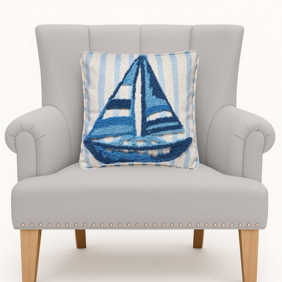 Coastal Sailboat Tufted Hooked Throw Pillow on an armchair, showing the throw pillow at room scale, 16x16 inch