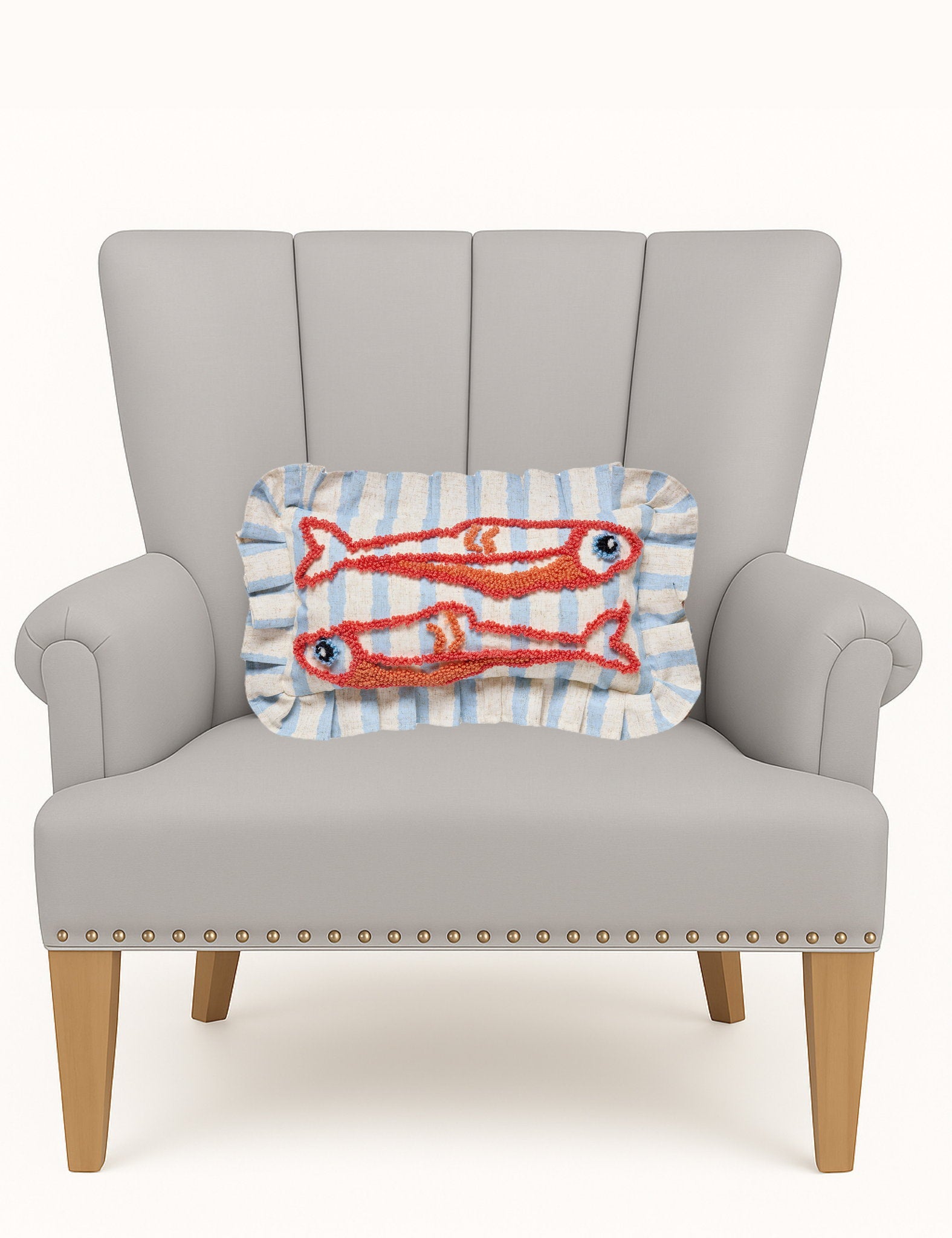 Coastal Sardines Tufted Hooked Throw Pillow on an armchair, showing the throw pillow at room scale, 9x16 inch
