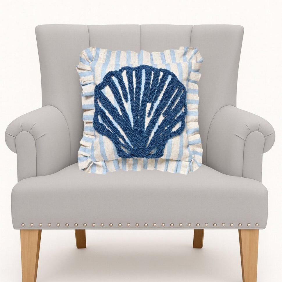 Coastal Shell Tufted Hooked Throw Pillow on an armchair, showing the throw pillow at room scale, 16x16 inch
