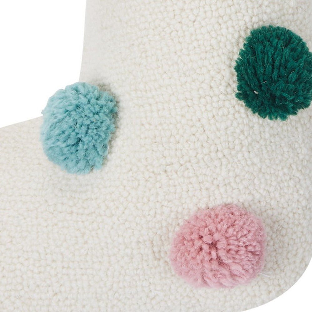 Closeup of Colorful Pom Poms Hooked Christmas Stocking showing stitch texture and craftsmanship detail