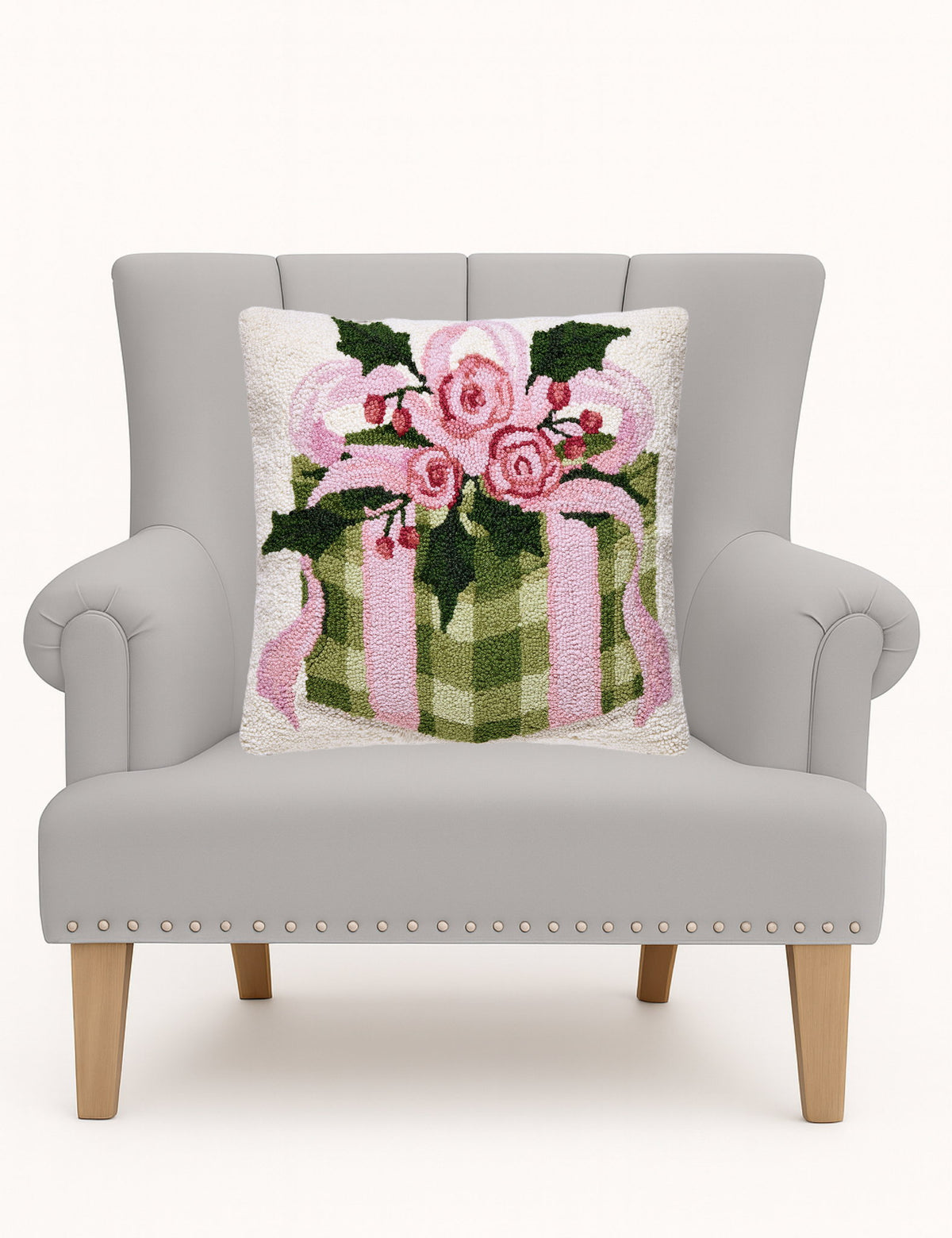 Cottage Charm Gift Hooked Wool Christmas Throw Pillow on an armchair, showing the throw pillow at room scale, 18x18 inch