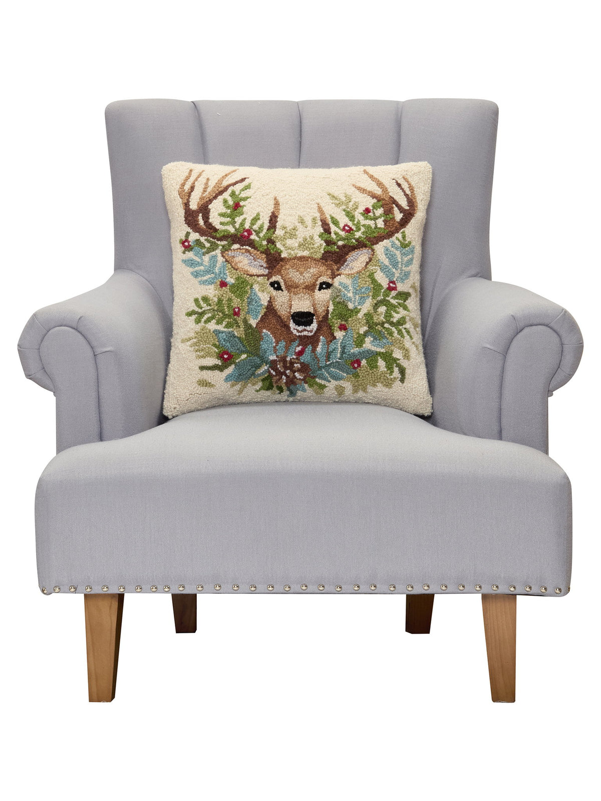Deer Hooked Wool Christmas Throw Pillow on an armchair, showing the throw pillow at room scale, 18x18 inch