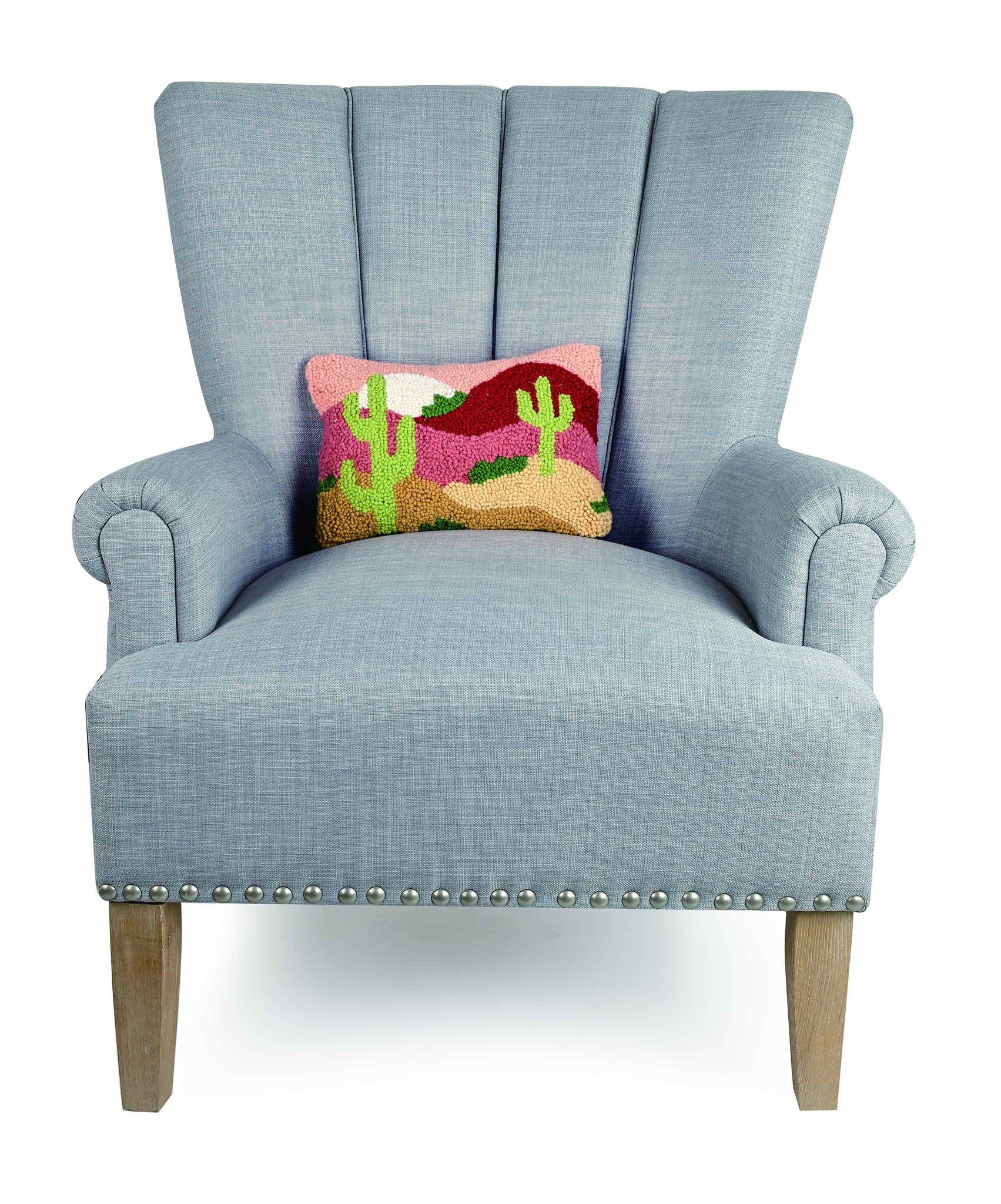 Desert Cactus Sunset Hooked Wool Throw Pillow on an armchair, showing the throw pillow at room scale, 8x12 inch