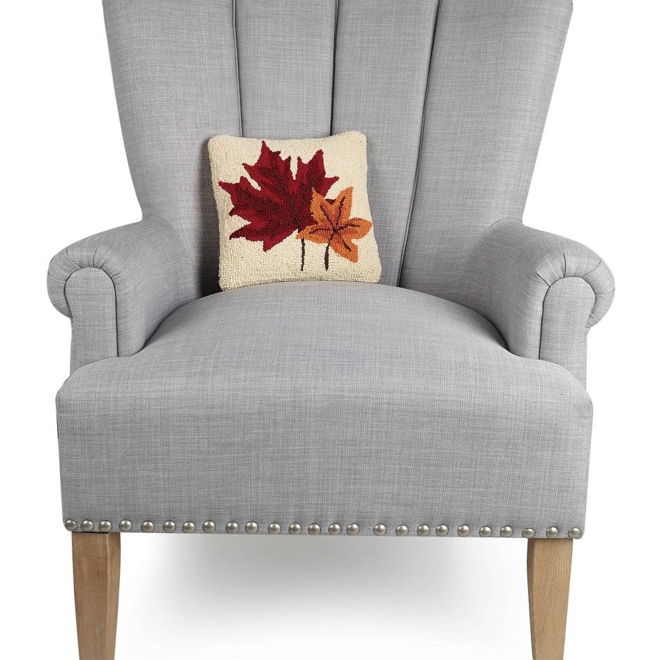 Fall Leaves Hooked Wool Throw Pillow on an armchair, showing the throw pillow at room scale, 10x10 inch