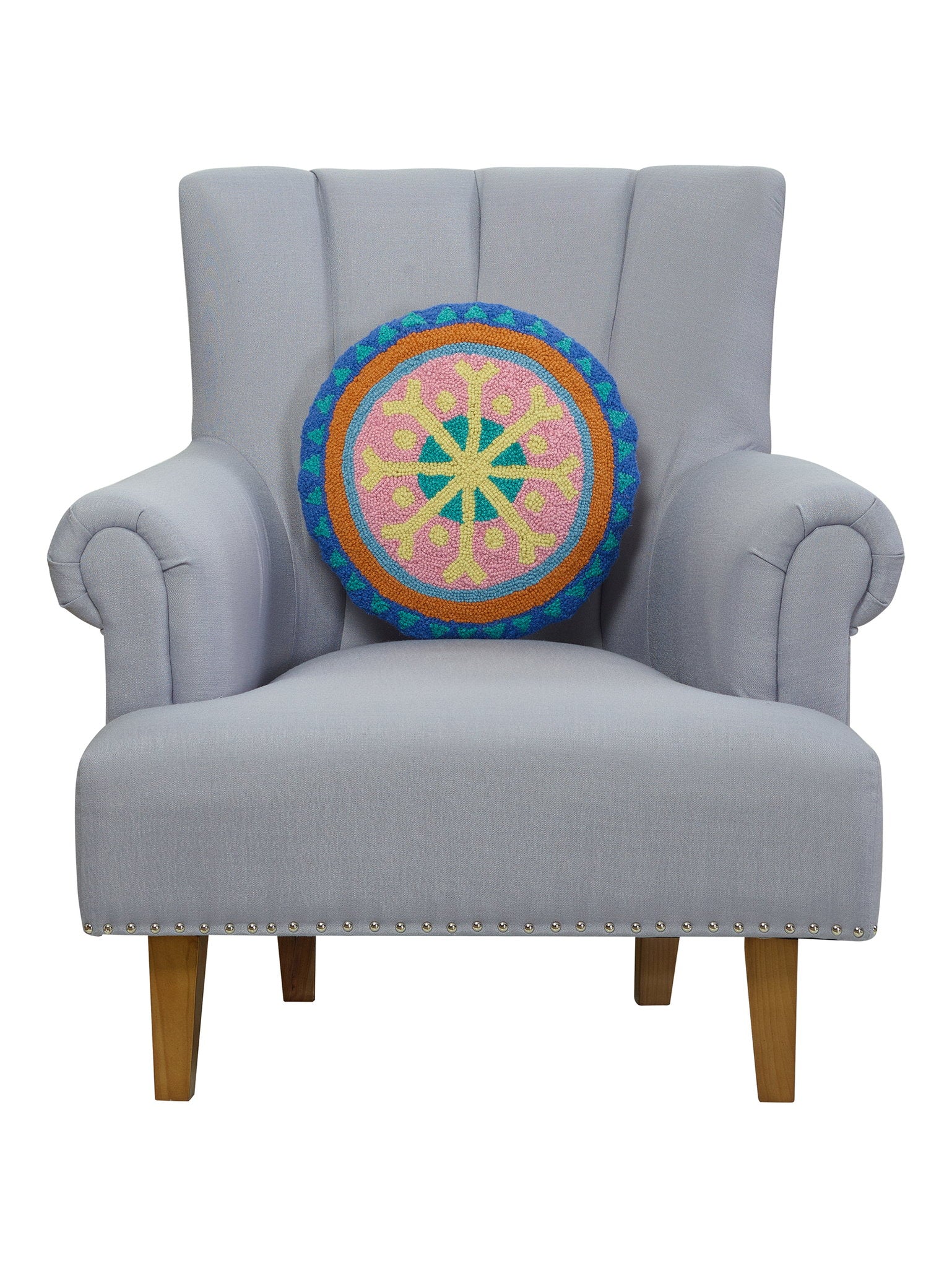 Festive Mandala Hooked Wool Christmas Throw Pillow on an armchair, showing the throw pillow at room scale, 16x16 inch