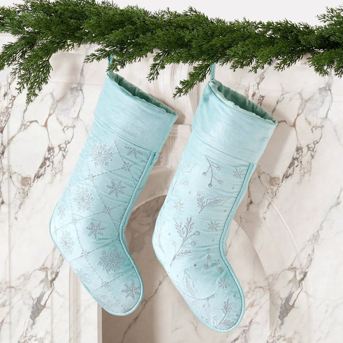 Frosty Blue Snowflake Embroidered Christmas Stocking styled in a room setting, 12x20 inch