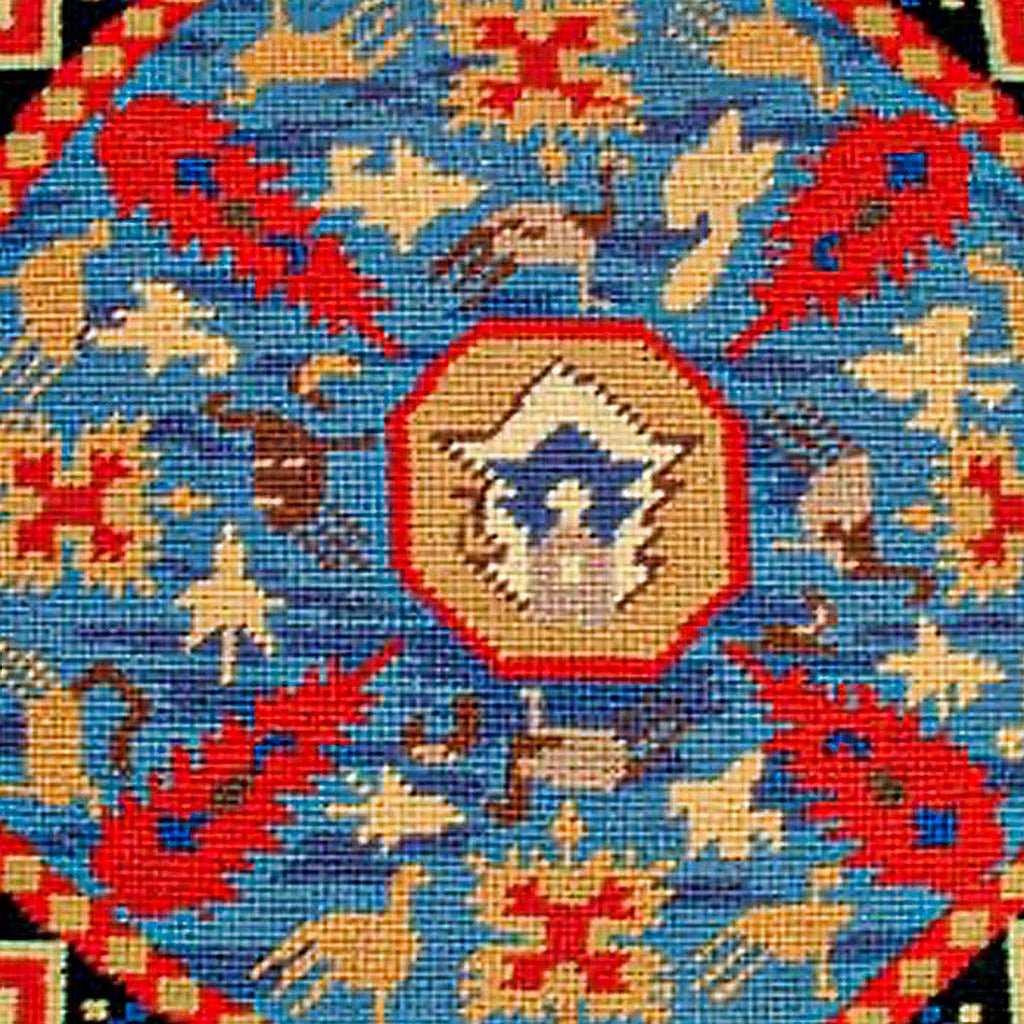 Hand-stitched wool detail of Geometric Caucasian needlepoint pillow showing intricate weave pattern and texture
