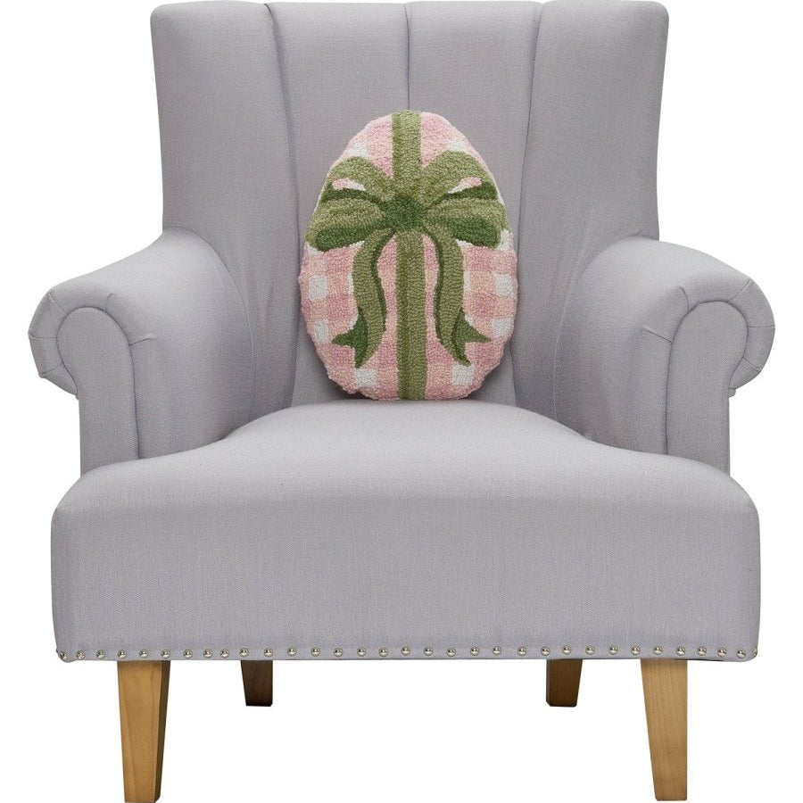 Gingham Easter Egg Hooked Wool Throw Pillow on an armchair, showing the throw pillow at room scale, 12x16 inch
