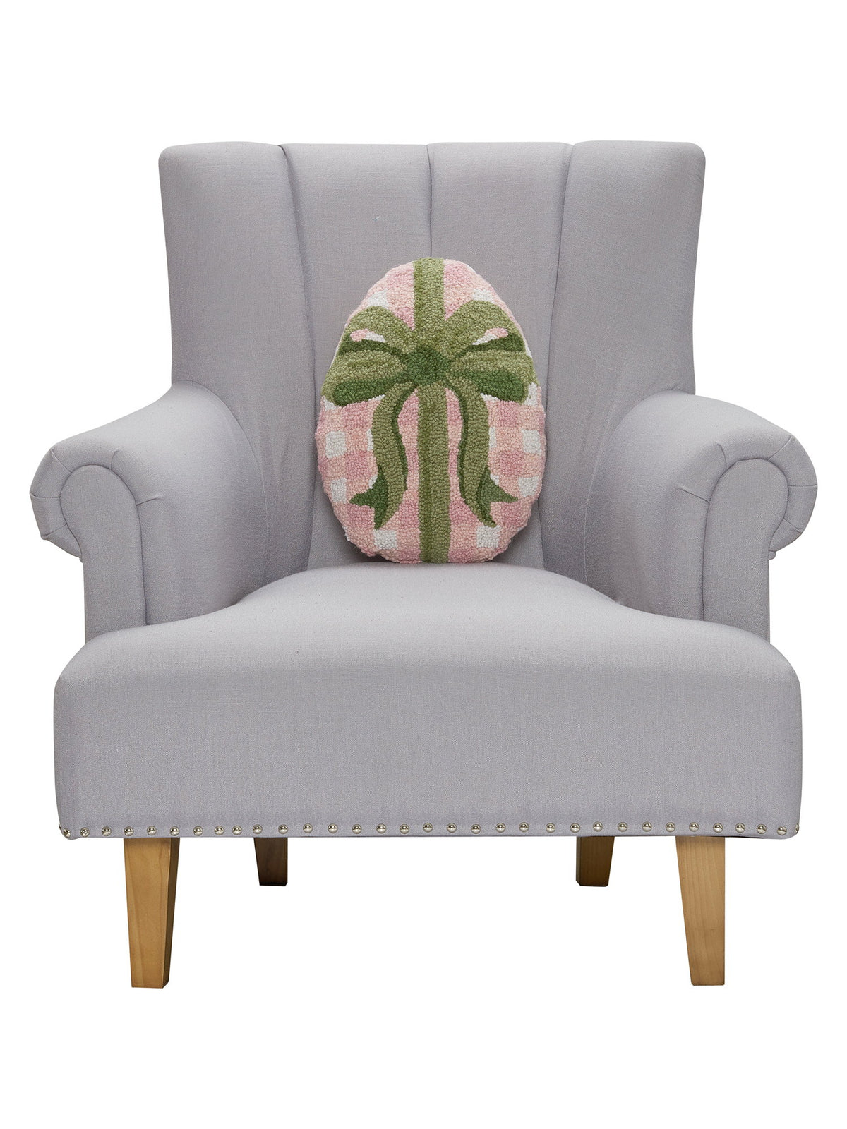 Gingham Easter Egg Hooked Wool Throw Pillow on an armchair, showing the throw pillow at room scale, 12x16 inch