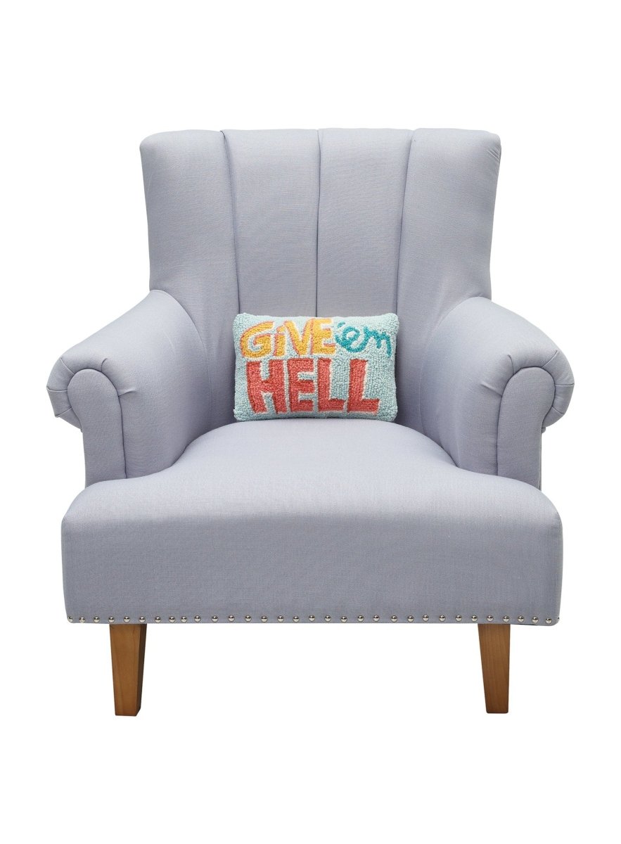 Give'em Hell Hooked Wool Throw Pillow on an armchair, showing the throw pillow at room scale, 8x12 inch