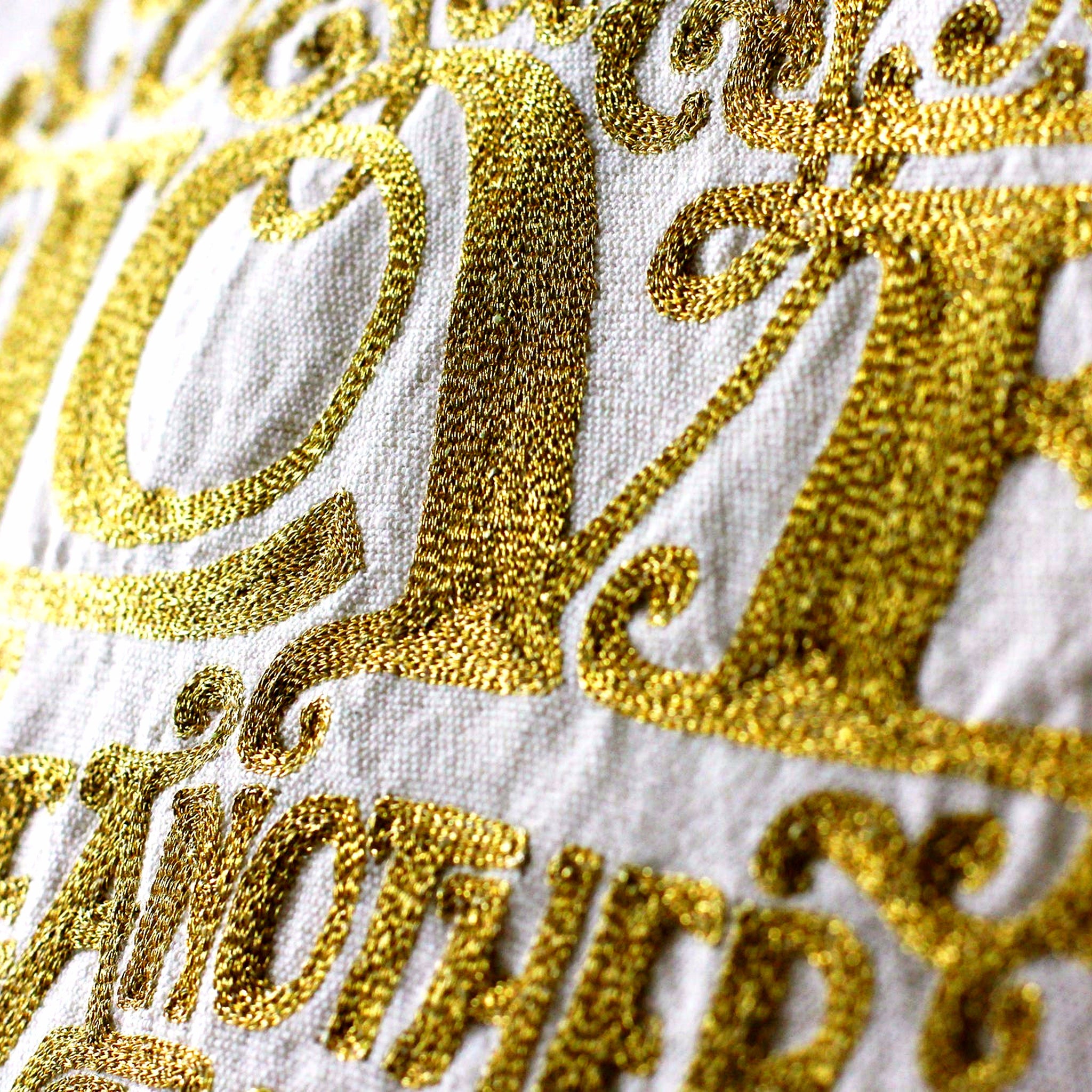 Gold Love Heart Embroidered Throw Pillow - close-up detail of hand-embroidered needlepoint stitching