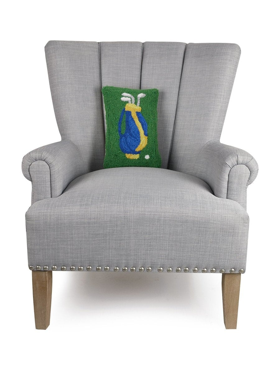 Golf Hooked Wool Throw Pillow on an armchair, showing the throw pillow at room scale, 8x12 inch