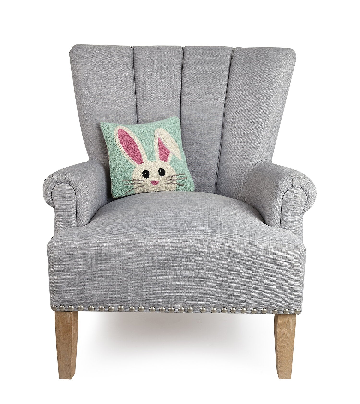 Hello Easter Bunny Hooked Wool Throw Pillow on an armchair, showing the throw pillow at room scale, 10x10 inch
