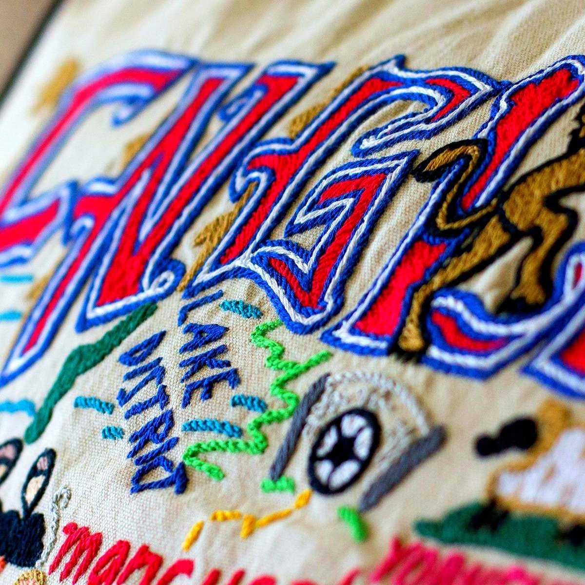 Historic Royal England Travel Embroidered Throw Pillow - close-up detail of hand-embroidered needlepoint stitching
