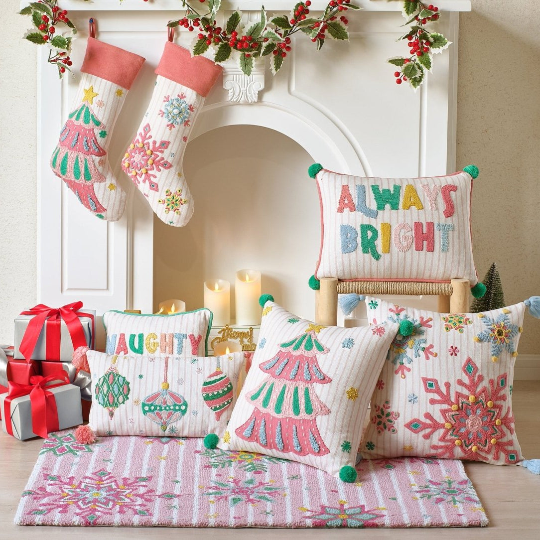 Holiday Bright's Snowflake Embroidered Christmas Stocking, 11x20 inch, hung at a fireplace with gifts and pillows