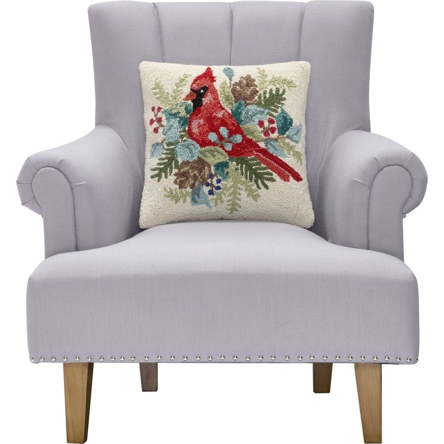 Holiday Cardinal Hooked Wool Throw Pillow on an armchair, showing the throw pillow at room scale, 16x16 inch
