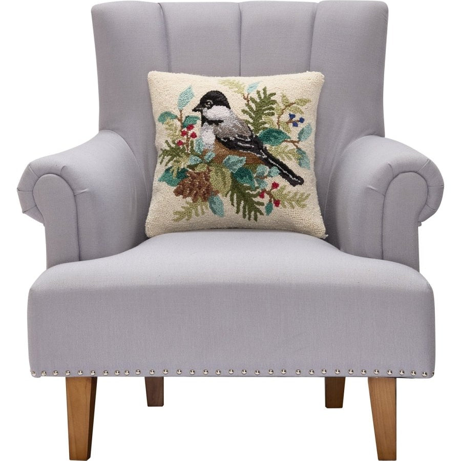 Holiday Chickadee Hooked Wool Throw Pillow on an armchair, showing the throw pillow at room scale, 16x16 inch