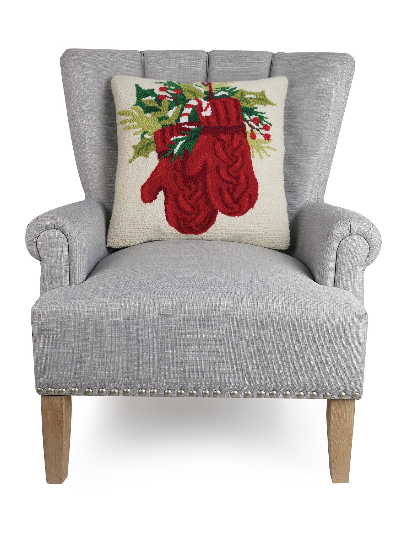 Holiday Mitten Hooked Wool Christmas Throw Pillow on an armchair, showing the throw pillow at room scale, 18x18 inch
