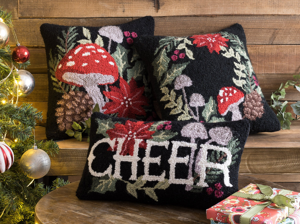 Holiday Mushrooms Cheer Hooked Wool Christmas Throw Pillow shown alongside other designs in the same collection, 9x16 inch