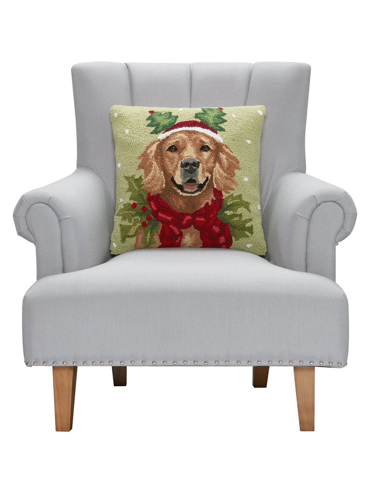 Holiday Retriever Hooked Wool Christmas Throw Pillow on an armchair, showing the throw pillow at room scale, 18x18 inch