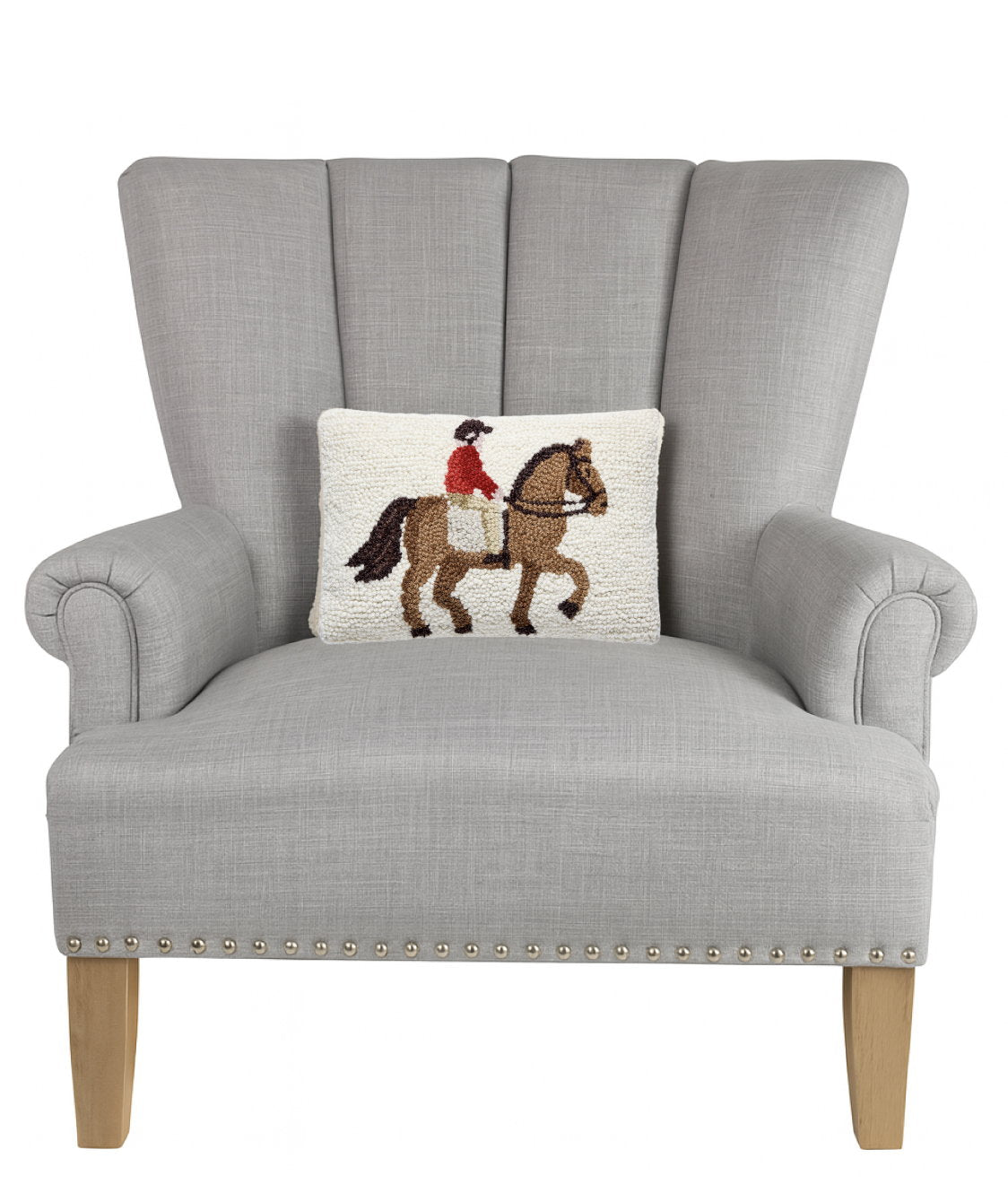 Horse Rider Hooked Wool Throw Pillow on an armchair, showing the throw pillow at room scale, 8x12 inch