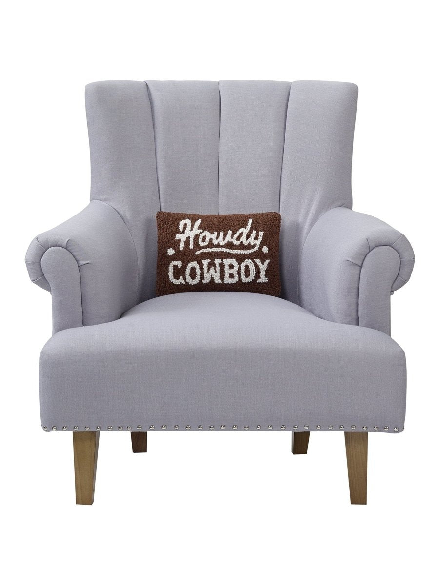 Howdy Cowboy Hooked Wool Throw Pillow on an armchair, showing the throw pillow at room scale, 8x12 inch