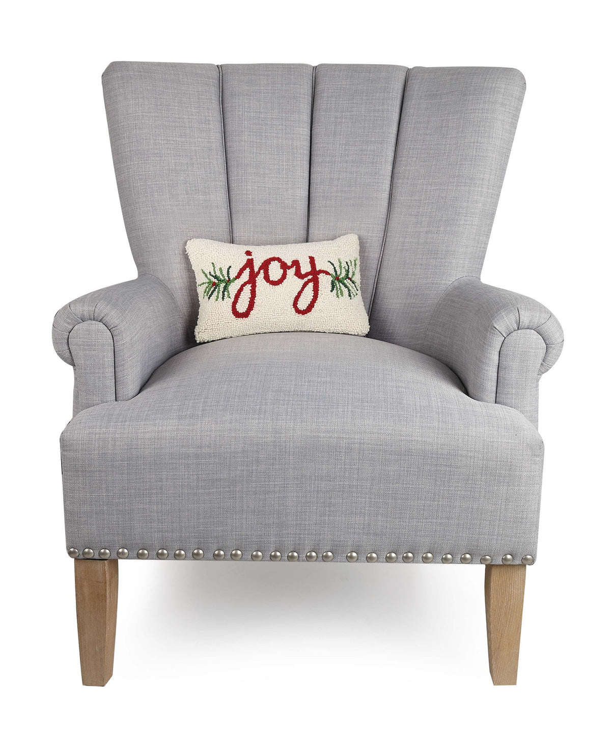 Joy Hooked Wool Christmas Throw Pillow on an armchair, showing the throw pillow at room scale, 8x12 inch