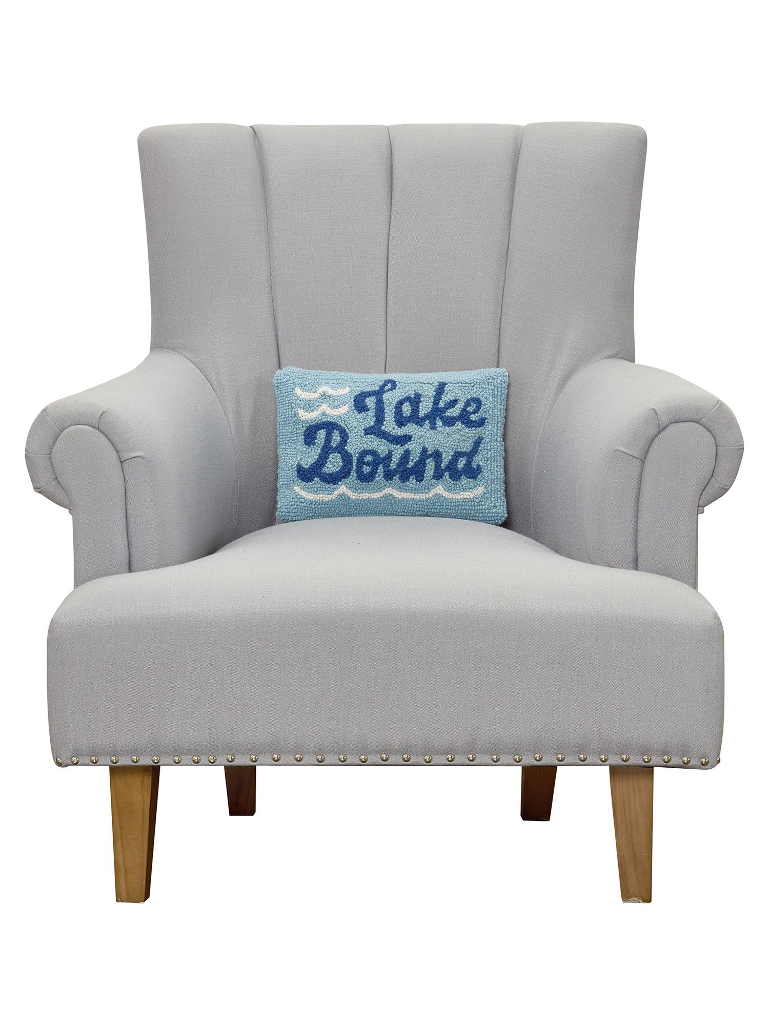 Lake Bound Hooked Wool Throw Pillow on an armchair, showing the throw pillow at room scale, 8x12 inch
