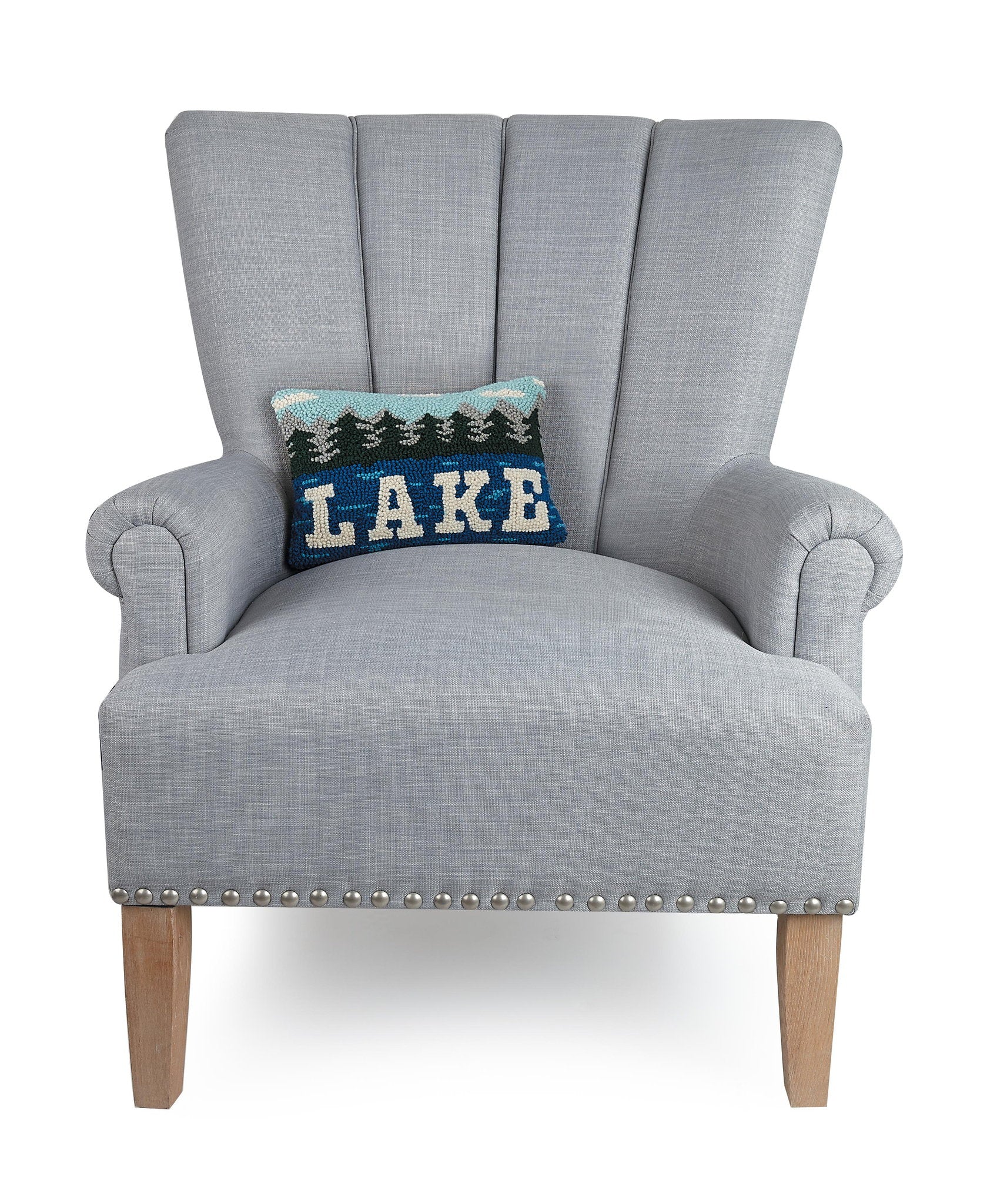 Lake Hooked Wool Throw Pillow on an armchair, showing the throw pillow at room scale, 8x12 inch