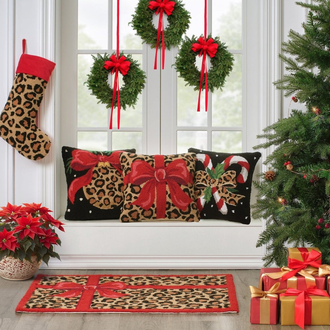 Leopard Christmas Hooked Wool Stocking shown alongside other designs in the same collection, 12x20 inch